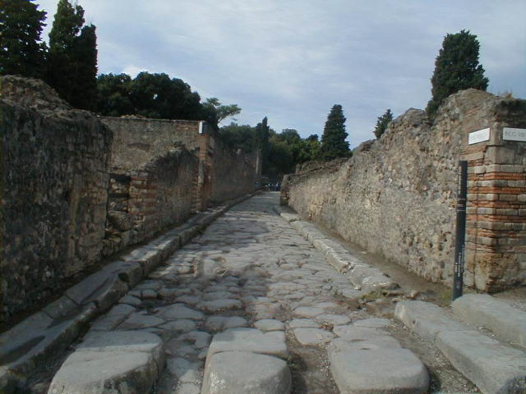 VIII.7 Pompeii. Via del Tempio d�Iside, looking west between temple and VIII.4.28, on corner. 




