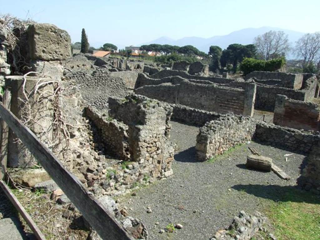 VIII.4.29 Pompeii. March 2009. Pompeii. Looking south east from south portico of VIII.4.15, onto lower level and the rear rooms of VIII.4.27 which looked onto garden area.