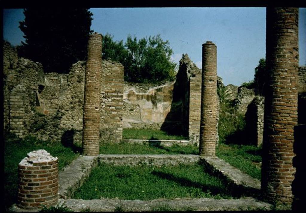 VIII.4.34 Pompeii.  Impluvium with four columns.  Photographed 1970-79 by G�nther Einhorn, picture courtesy of his son Ralf Einhorn.


