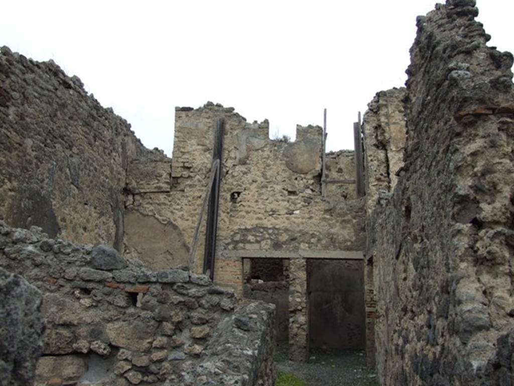 VIII.4.37 Pompeii. House with workshop. December 2007. Two rooms and remains of doorway in upper floor.
