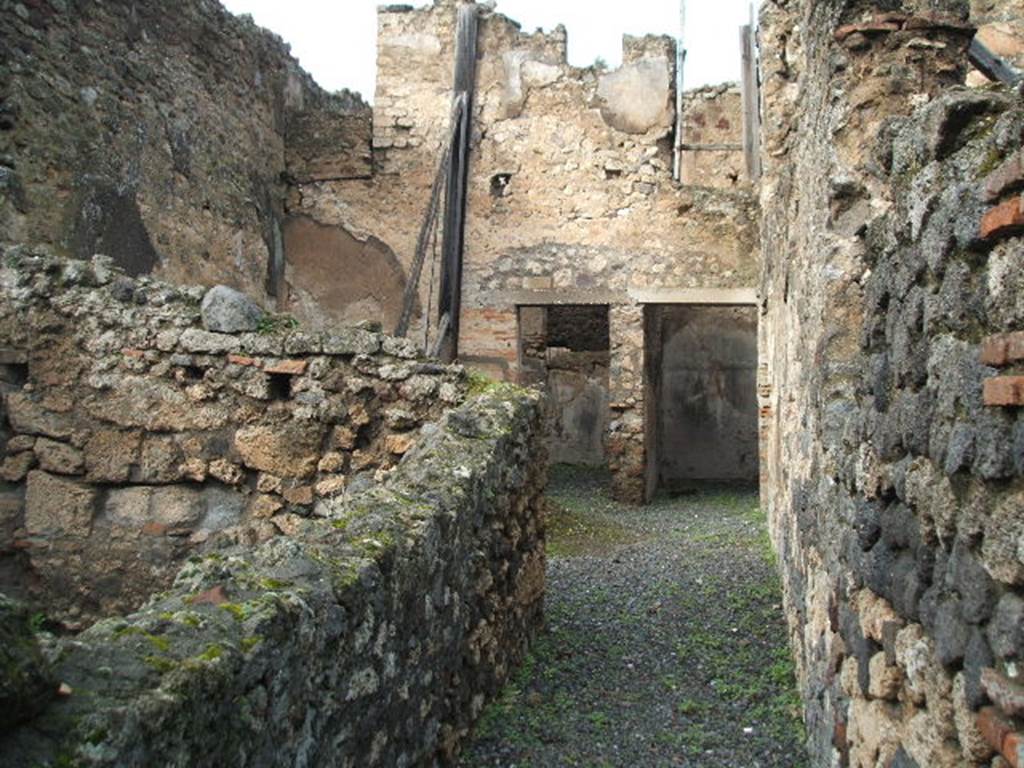 VIII.4.37 Pompeii. House with workshop. December 2004. Looking north along entrance corridor.