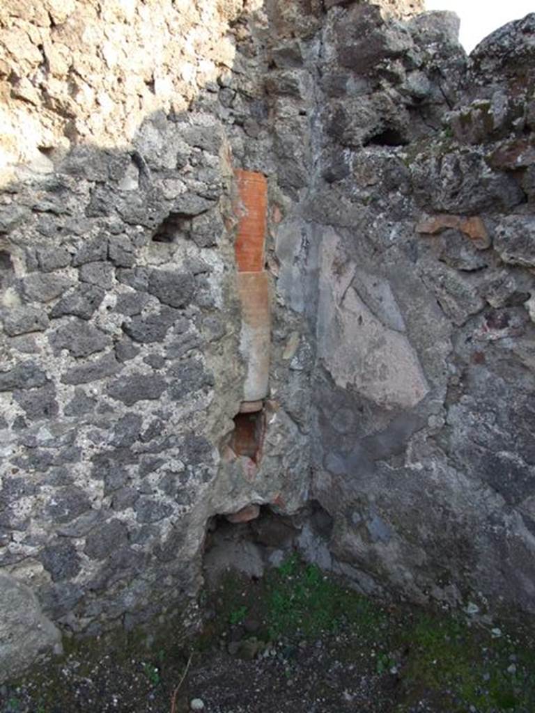 VIII.5.3 Pompeii. December 2007. South-east corner of shop, with waste pipe from upper floor.