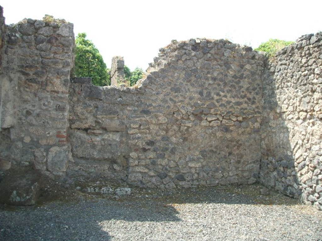 VIII.5.10 Pompeii. Shop. May 2005. South wall, with blocked door to atrium of VIII.5.9.