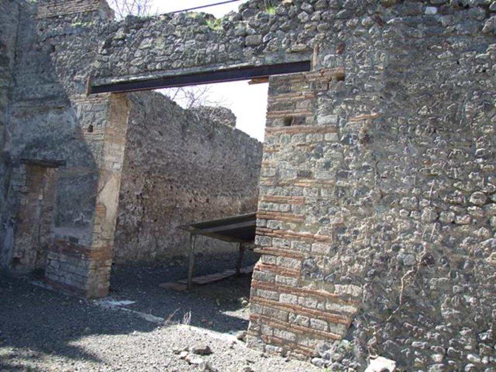 VIII.5.28 Pompeii. March 2009. Doorways to room 11, large triclinium.
According to PPM � in this room -
�Pernice described the only mosaic floor of the house, in black tesserae with a white tesserae border and threshold with an ivy branch made in black on a white background. (III Style).�
See Carratelli, G. P., 1990-2003. Pompei: Pitture e Mosaici.8 (VIII). Roma: Istituto della enciclopedia italiana, (p. 611).
