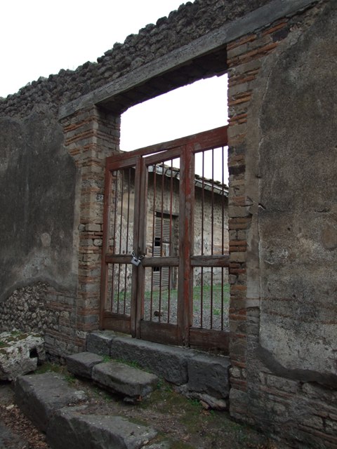VIII.5.37 Pompeii. December 2007. Looking north from entrance across atrium and remains of impluvium.