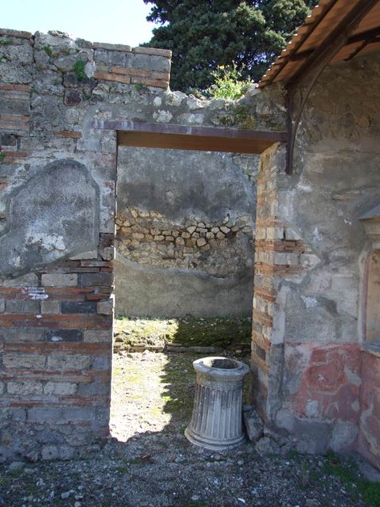 VIII.5.37 Pompeii. March 2009. Doorway to Room 5, Ala, with marble puteal.