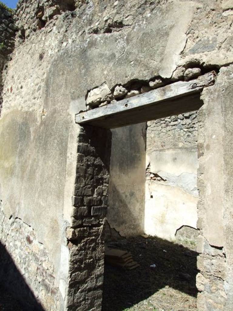 VIII.5.37 Pompeii. March 2009. Room 11. North wall and Doorway to Room 12.