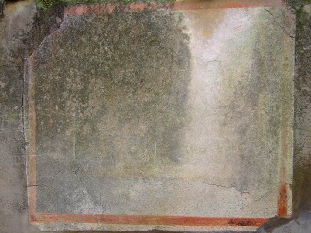 VIII.5.39 Pompeii. March 2009. Room 3, faded lararium painting on south wall of kitchen. On the south wall of the kitchen was a painting of Fortuna, with the usual attributes, a cornucopia, and a rudder resting on a ball. The Genius and the Lares appear nowhere, and as a lotus blossom was painted on the forehead of the goddess, she was thought to be a form of Isis. See Mau, A., 1907, translated by Kelsey F. W. Pompeii: Its Life and Art. New York: Macmillan, p.341-343. See Fröhlich, T., 1991. Lararien und Fassadenbilder in den Vesuvstädten. Mainz: von Zabern, L97 on page 293 and Taf 46,2. According to Boyce, on the south wall of the kitchen beneath the window was a painting of Isis-Fortuna. This was painted on a rough rectangle of white plaster, bordered in red. The goddess stands, a wreath of leaves upon her head, the lotus flower on her forehead, her dark hair falling over her shoulders. She wears a long yellow chiton and blue mantle.
In her left hand, she held a cornucopia. In her right hand, she held a yellow rudder, the lower end of which rested upon a globe. To the right and left of her, there were large shrubs with red flowers. See Boyce G. K., 1937. Corpus of the Lararia of Pompeii. Rome: MAAR 14. (p.78, no.372)