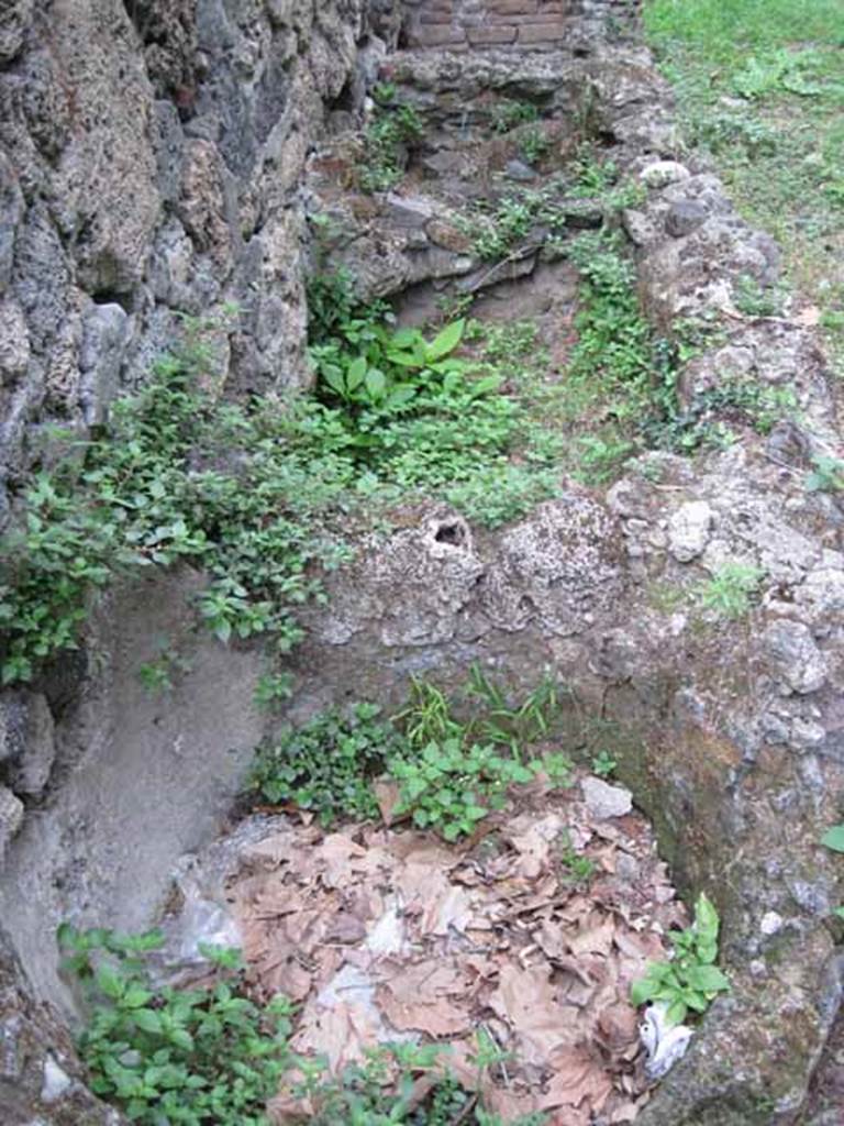VIII.7.1 Pompeii. September 2010. Feature on north wall of entrance room.
Three rectilinear basins or watering troughs for horses? Photo courtesy of Drew Baker.