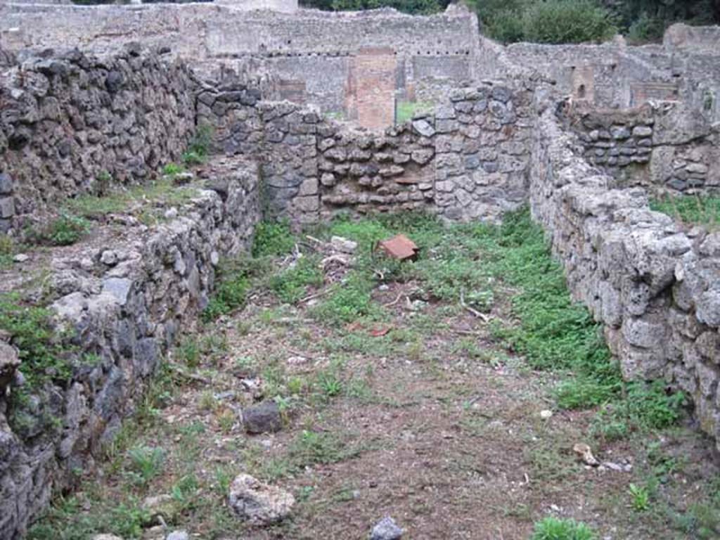 VIII.7.1 Pompeii. September 2010. Second room east of corridor, Fiorelli thought possibly a dormitory. Looking east towards Via Stabiana, (blocked doorway to VIII.7.4). Photo courtesy of Drew Baker. During excavations in 2006 a drain was found in the centre of the room running from west to east (front to back in this photo). The drain continued to the street where a rectangular exit point is still visible in the front of the kerb. See http://www.fastionline.org/docs/FOLDER-it-2006-71.pdf