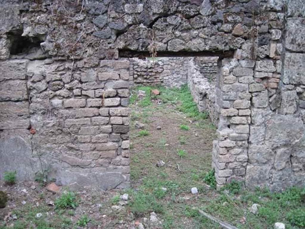VIII.7.1 Pompeii. September 2010. Looking east through doorway from garden area, into dormitory room. Photo courtesy of Drew Baker.