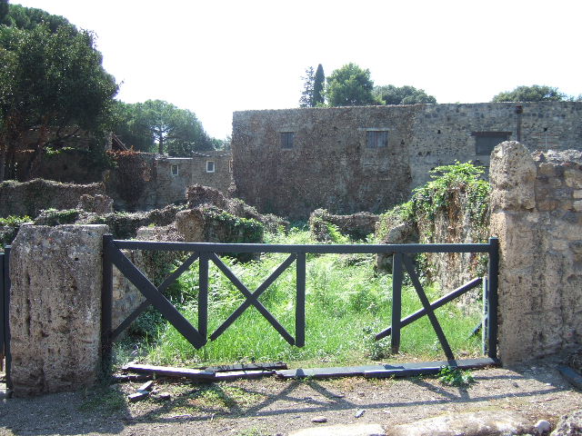 VIII.7.11 Pompeii. September 2010. Triclinium on south side of corridor, looking east towards doorway to corridor in north-east corner. Photo courtesy of Drew Baker.