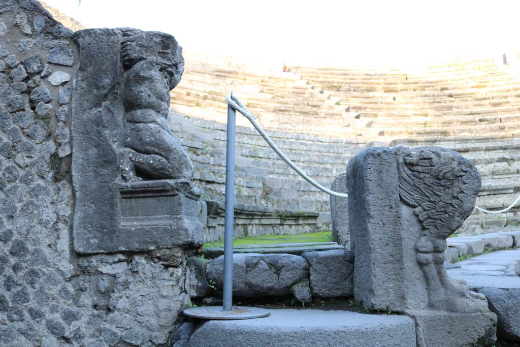 VIII.7.19 Pompeii. December 2018.
Looking north on west side towards statue of Kneeling Atlas, with a tufa Lion’s foot in front. Photo courtesy of Aude Durand.