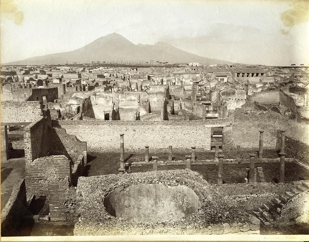 VIII.7.20/21 Pompeii. Looking north, across perfumed water tank at the rear of the Large Theatre, towards VIII.7.29, Samnite Palaestra.
Photograph No. 1285, by Giorgio Sommer, (1834-1914). Public domain, via Wikimedia Commons