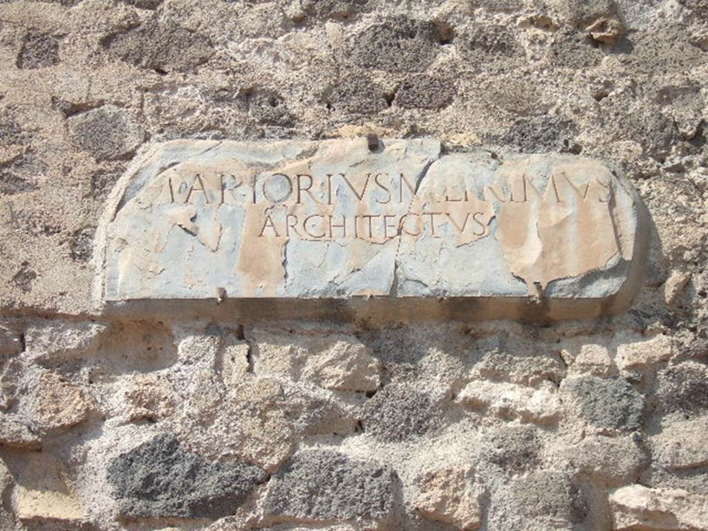 VIII.7.21 Pompeii. September 2005. Plaque on wall between theatres.
M(ARCVS) ARTORIVS M(ARCI) L(IBERTVS) PRIMVS
ARCHITECTVS
M(arcus) Artorius M(arci) l(ibertus) Primus / architectus
Marcus Artorius Primus, freedman of Marcus, architect.
See Cooley, A. and M.G.L., 2004. Pompeii : A Sourcebook. London : Routledge. (p.67, D52). CIL X 841=ILS 5638a.