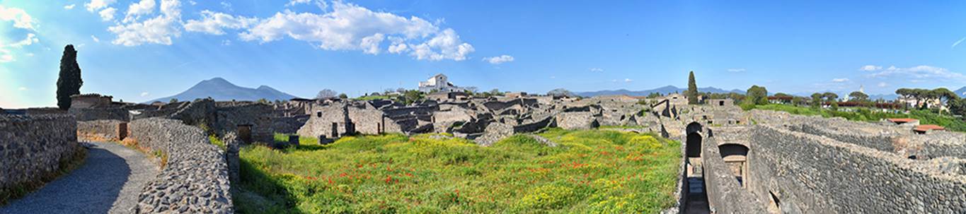 VIII.7.21 Pompeii, on left. April 2018.
Looking north-east from upper level of large theatre towards Vesuvius, across garden of VIII.7.26 and 24 and with the passages to theatres, on the right. Photo courtesy of Ian Lycett-King. Use is subject to Creative Commons Attribution-NonCommercial License v.4 International.