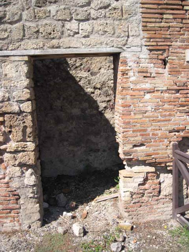 VIII.7.23 Pompeii. October 2010. West wall of small room or latrine with a blocked door (pictured). This used to lead into the VIII.7.24 storeroom.
Photo and information courtesy of Drew Baker/Gareth Beale/Hembo Pagi
