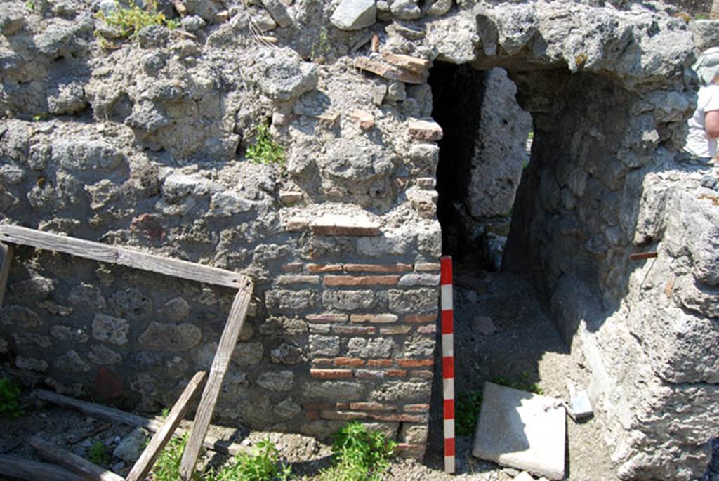 VIII.7.24 Pompeii. June 2009. West wall and entrance leading along corridor into “storage room”. Photo courtesy of Sera Baker.