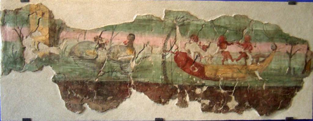 VIII.7.24 Pompeii. Found on the north wall of the peristyle in 1955. Nile scene.
Two pygmies dance on a papyrus boat with phallic prow.
Fragment of a painting originally part of a larger illustration with Nilotic subject that decorated the peristyle.
SAP inventory number 41654.
About 24 metres remained.
A description of the entire fresco covering the peristyle wall can be found in Roman domestic art and early house churches, by David L. Balch, p. 221-3.
See POMPEI 1748-1980, i tempi della documentazione, p. 164-5, 20 C3.
Maiuri gives a complete description of the house and the paintings found.
See Maiuri, A., 1955. Una nuova pittura nilotica a Pompei. Rome: Acc. Nazionale dei Lincei.