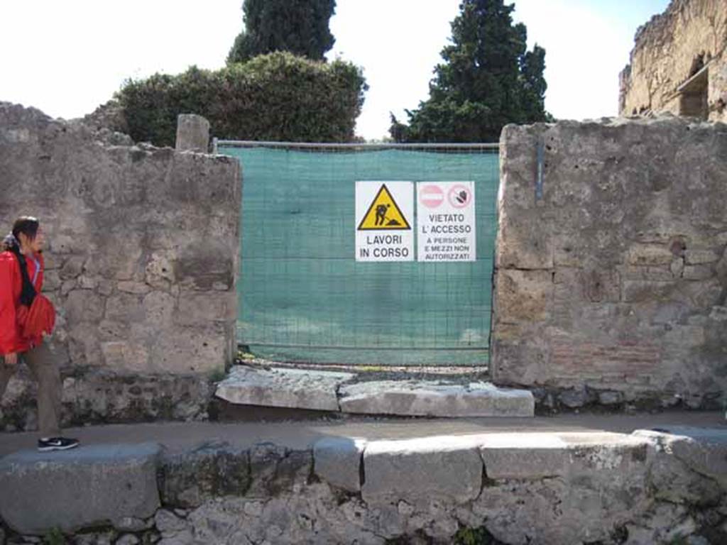 VIII.7.24 Pompeii. September 2010. Entrance, looking west.  Photo courtesy of Drew Baker.
This house is a little confusing as it is split into two levels. The entrance level consisted of atrium and surrounding rooms, probably used as the sculptor�s workshop. Fifteen steps led up to the upper part being the dwelling area, including the garden area surrounded by portico on four sides, a triclinium, cubiculi, another kitchen, and perhaps an exedra. Below the upper part would have been the areas of VIII.7.22 and 23. According to Fiorelli, the house was of very ancient construction but transformed into a workshop. This entire area is now very ruined.
According to Cooke Cockburn & Donaldson, the sculptor�s residence was one of the most interesting discoveries of the city. Found in it were statues of marble, some merely begun, others half-finished; with blocks of marble for other statues, and all the tools necessary for the artist. Among these, thirty-two mallets, many compasses, curved and straight, an infinity of chisels, three or four levers and jacks for raising blocks, saws, etc.
See Cooke Cockburn Donaldson, Pompeii, pt.1, 1827, (p.47)

