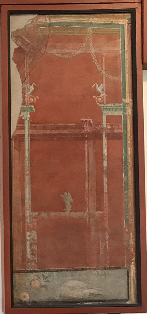 VIII.7.28 Pompeii. April 2019. West portico.
Fresco with architecture, swans, bronze sphinx and still life panel with two peaches and dead pigeon.
Now in Naples Archaeological Museum. Inventory number 8536.
Photo courtesy of Rick Bauer.