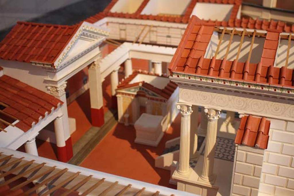 VIII.7.28 Pompeii. Model of temple now in Naples Museum. Looking south along east side of portico towards purgatorium.
Photo courtesy of Giampiero Bevagna.