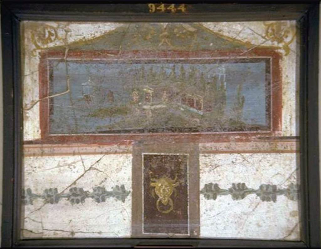 VIII.7.28 Pompeii. South part of east wall of portico.
Landscape, surmounted by a pediment and with a small panel underneath with a bovine head.
Now in Naples Archaeological Museum. Inventory number 9444.