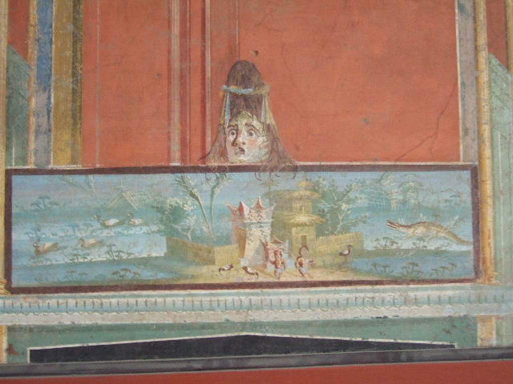 VIII.7.28 Pompeii. From the left of the east wall of the portico.
Detail of Nilotic scene with two pigmies and surmounted by a female theatrical mask.
Now in Naples Archaeological Museum. Inventory number 8607.