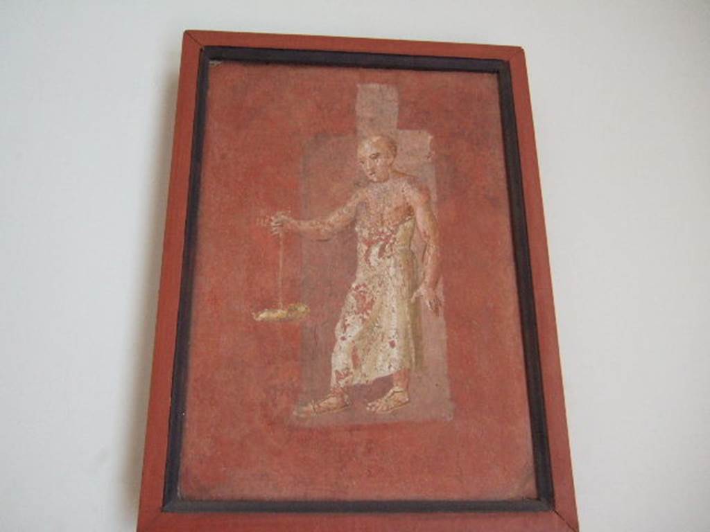 VIII.7.28 Pompeii. Priest carrying oil lamp, found on feature on right part of south wall.
Now in Naples Archaeological Museum. Inventory number 8969.