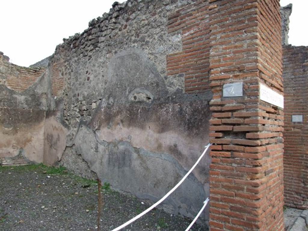 IX.1.4 Pompeii. March 2009. Plaster above hearth in south-east corner of rear room. 