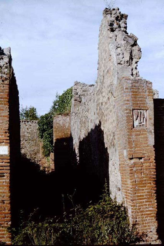 IX.1.5 Pompeii. 1964. Looking east to entrance doorway, with plaque on south side. Photo by Stanley A. Jashemski.
Source: The Wilhelmina and Stanley A. Jashemski archive in the University of Maryland Library, Special Collections (See collection page) and made available under the Creative Commons Attribution-Non Commercial License v.4. See Licence and use details.
J64f1329
