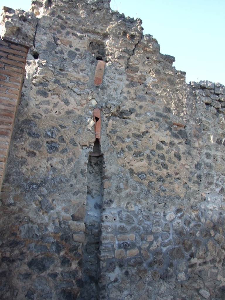 IX.1.6 Pompeii. March 2009. North-west corner of bar room. Drainpipe from upper level.