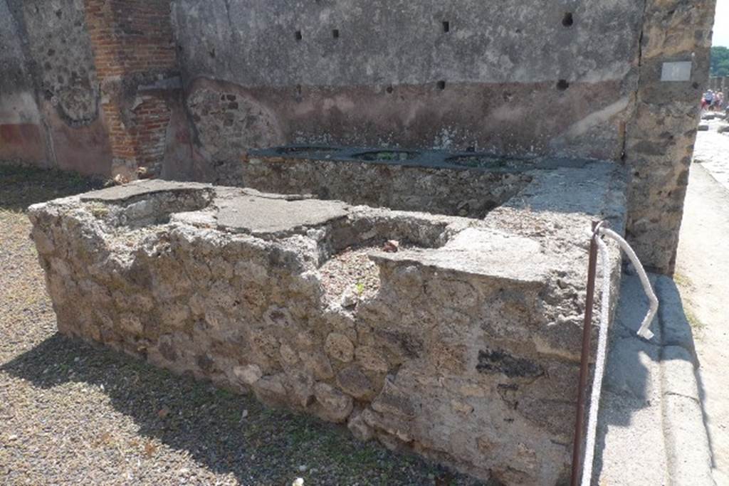 IX.1.8 Pompeii. December 2007. Remains of base of steps to upper floor against the north wall in rear room.