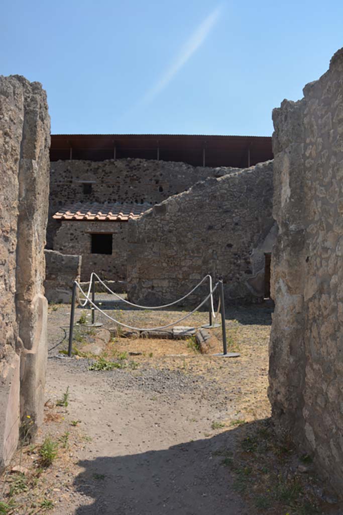IX.1.12 Pompeii. December 2007. Two doorways to rooms on north side of atrium.
