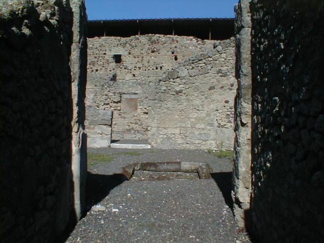 IX.1.12 Pompeii. December 2007. South side of atrium with doorway to cubiculum and small room or cupboard.