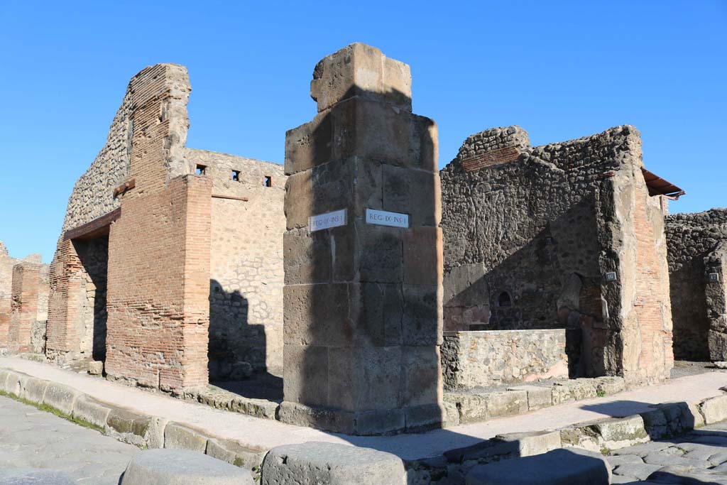 IX.1.15 Pompeii. May 2005. Entrance on Via Stabiana. Looking east.
According to Della Corte, this was a large caupona of the usual form with rear and upstairs room.  He thought it would have been in the possession of a Primus, according to the recommendations written on the left of entrance IX.1.15.

A(ulum)  Vettium  Caprasium
Felicem  aed(ilem)  Primus  rog(at)      [CIL IV 953]       

M(arcum)  Holconium  Priscum 
aed(ilem)  primus  rog(at)  Proculu(s)      [CIL IV 966] 
See Della Corte, M., 1965.  Case ed Abitanti di Pompei. Napoli: Fausto Fiorentino. (p.210)

