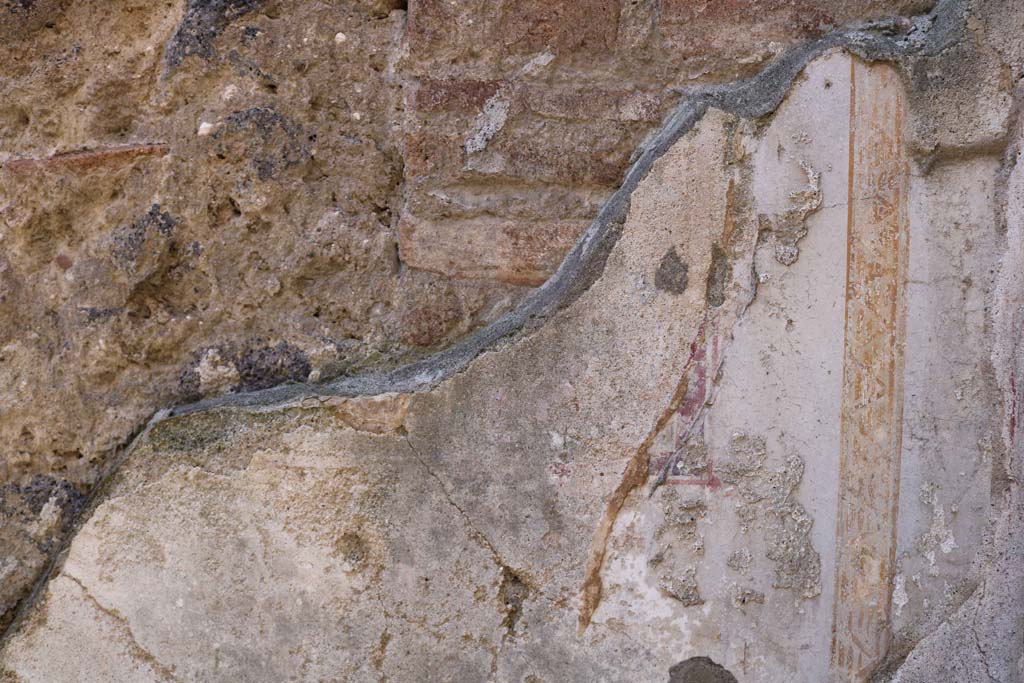 IX.1.16 Pompeii. December 2018.
Detail of painted decoration from west wall in north-west corner of rear room. Photo courtesy of Aude Durand.