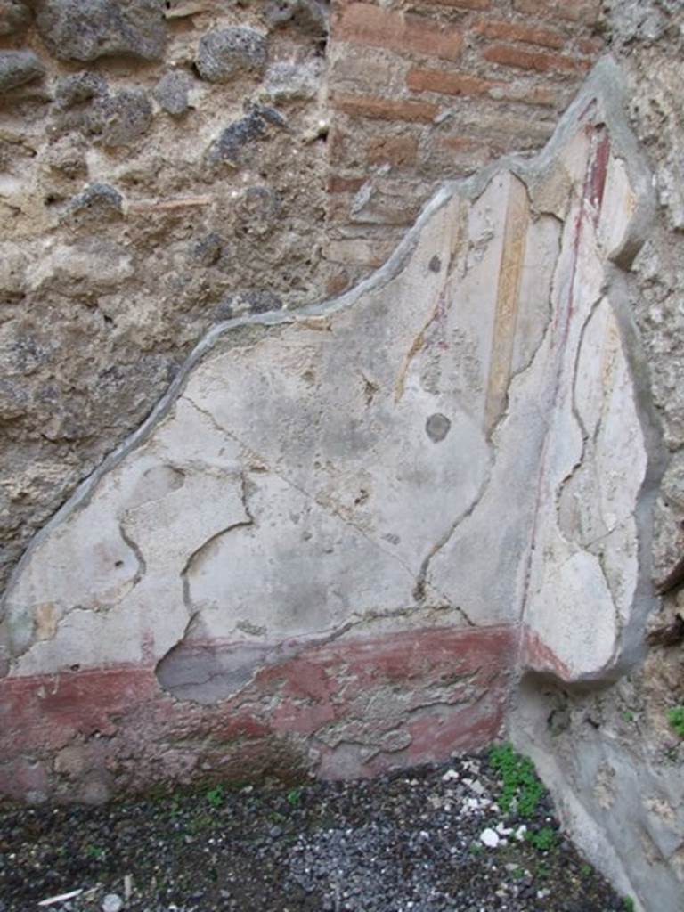 IX.1.16 Pompeii. December 2007. Painted wall plaster on west wall in north-west corner of rear room.