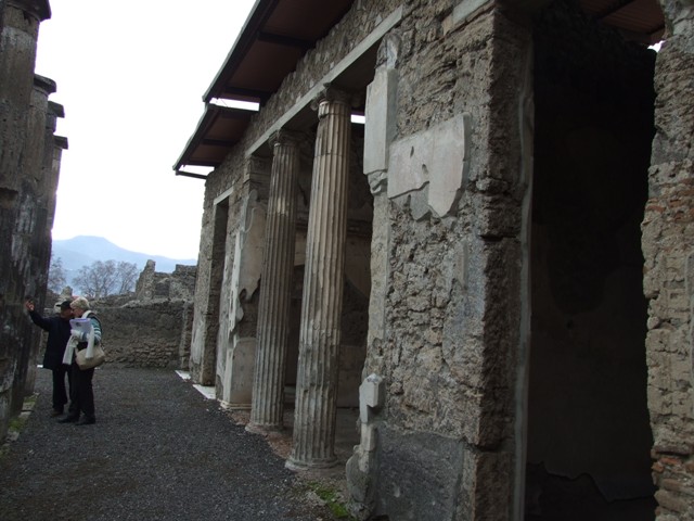 IX.1.20 Pompeii.  December 2007.  Room 2.  Atrium west side. Figured capital from south western corner consisting of a full figure relief of satyrs and bacchantes.
