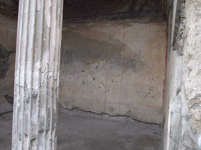 IX.1.20 Pompeii.  December 2007.  Room 2.  Atrium, West Side.  Figured capital from north western corner consisting of a full figure relief of satyrs and bacchantes.
