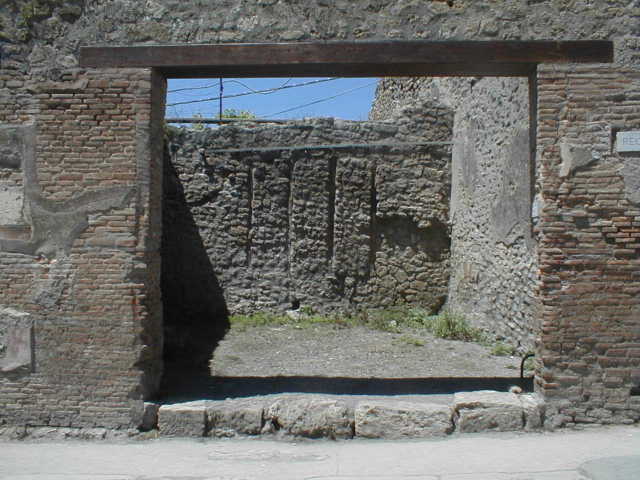 IX.1.27 Pompeii. March 2009. West wall, with base of stairs to upper floor and bed recess.