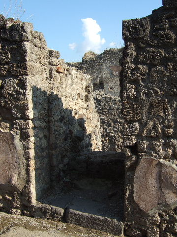IX.1.34 Pompeii. Stairs to upper floor with latrine of IX.1.1 behind.