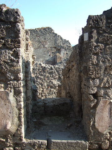 IX.1.34 Pompeii. May 2010.Latrine to the south and under the stairs to upper floor.