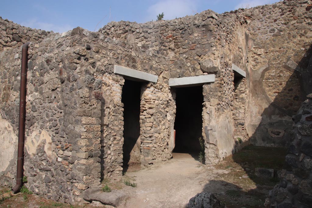 IX.2.7 Pompeii. October 2023.
Looking north-east towards doorways to rooms (i), (k), and garden area (h). on right. Photo courtesy of Klaus Heese.