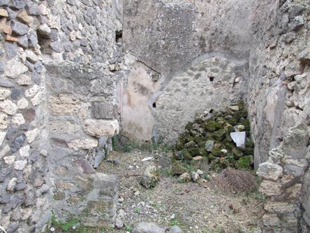 IX.2.16 Pompeii. December 2007. Small storeroom on south-east side of peristyle next to staircase, shown as room “o” in PPM.
On the right of the photo is the doorway leading into a corridor, at the far end of the corridor is the kitchen.
According to Schefold, the location of the lararium was in this room.   
See Schefold, K., 1957. Die Wände Pompejis. Berlin: De Gruyter. (p.241-243)
According to BdI, “from the corridor, a side door gave access to a square room, which has not conserved any of the original decoration other than traces of figures enclosed in red and black compartments and a lararium painting divided into two zones”.
See Bullettino dell’Instituto di Corrispondenza Archeologica (DAIR), 1871, (p. 201)
According to Giacobello –
The painting was seen on the north wall of a storeroom/cupboard (room “o”). 
See Giacobello, F., 2008. Larari Pompeiani: Iconografia e culto dei Lari in ambito domestico. Milano: LED Edizioni, (p.204, no.97)

