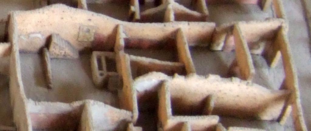 Part of the cork model of Pompeii in the Naples Archaeological Museum showing IX.2.24. The yard on the left shows the staircase and the Lararium referred to by Fr�hlich. See Fr�hlich, T., 1991, Lararien und Fassadenbilder in den Vesuvst�dten.  Mainz: von Zabern.  (L99: p.293, T. 42,3). 
