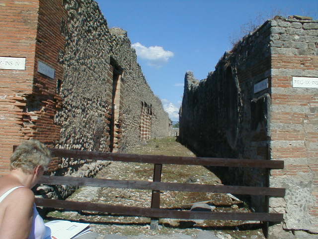 IX.4 Pompeii. September 2004. Unnamed vicolo, looking east from Via Stabiana near IX.3.1.   On the north-west corner of the insula IX.3 (on the right), painted graffiti was found in September 1843:

Cn(aeum)  Helvium
Sabinum  aed(ilem)
vicini  fac[(iunt)      [CIL IV 852]

L(ucium)  C(eium)  S(ecundum)  II vir(um)    [CIL IV 853]

See Pagano M. and Prisciandaro, R., 2006. Studio sulle provenienze degli oggetti rinvenuti negli scavi borbonici del regno di Napoli.  Naples : Nicola Longobardi.  (p.159)
