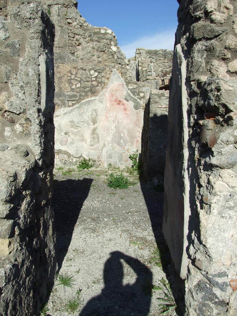 IX.3.2 Pompeii. March 2009.
Room on north side of garden area. Looking east through small door from former atrium.