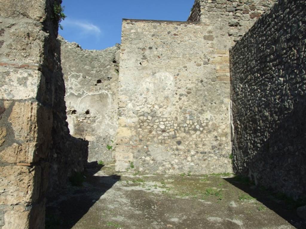 IX.3.4 Pompeii. March 2009. Plaster on south wall of rear room in north-east corner of shop.