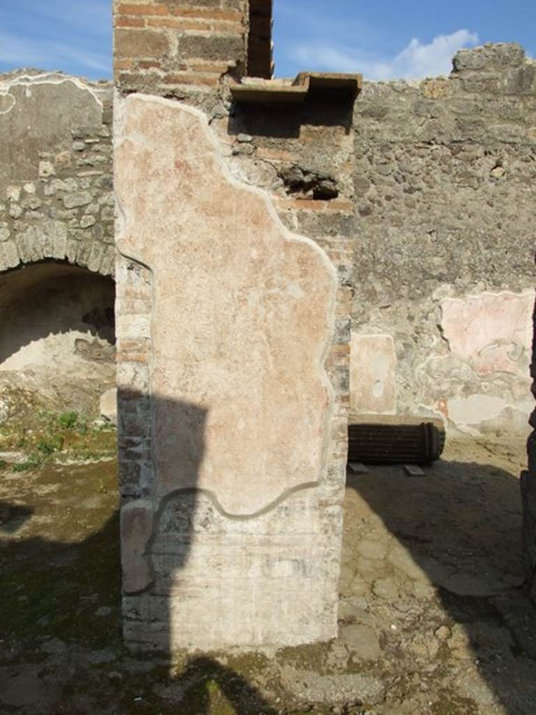 IX.3.5 Pompeii. March 2009. Remains of painted plaster between rooms 27 and 20